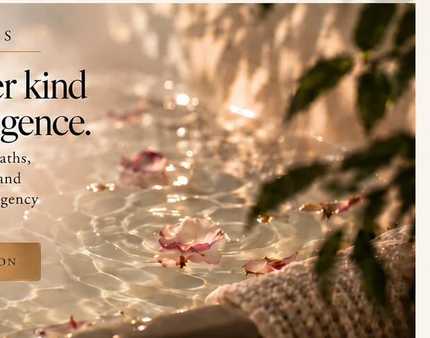 A soft bath soak poured beside linen and warm light.